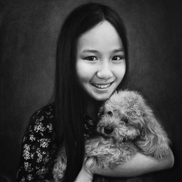 Commissioned portrait of a beautiful girl and her dog. Black and white charcoal drawing.